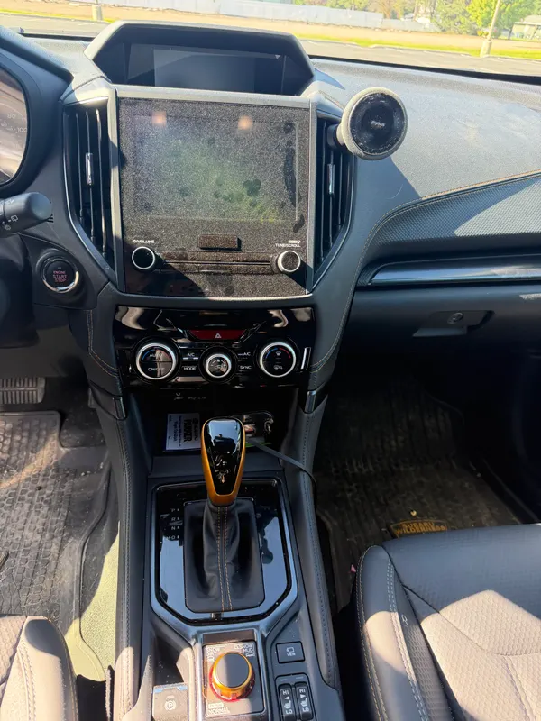Subaru center console before detailing