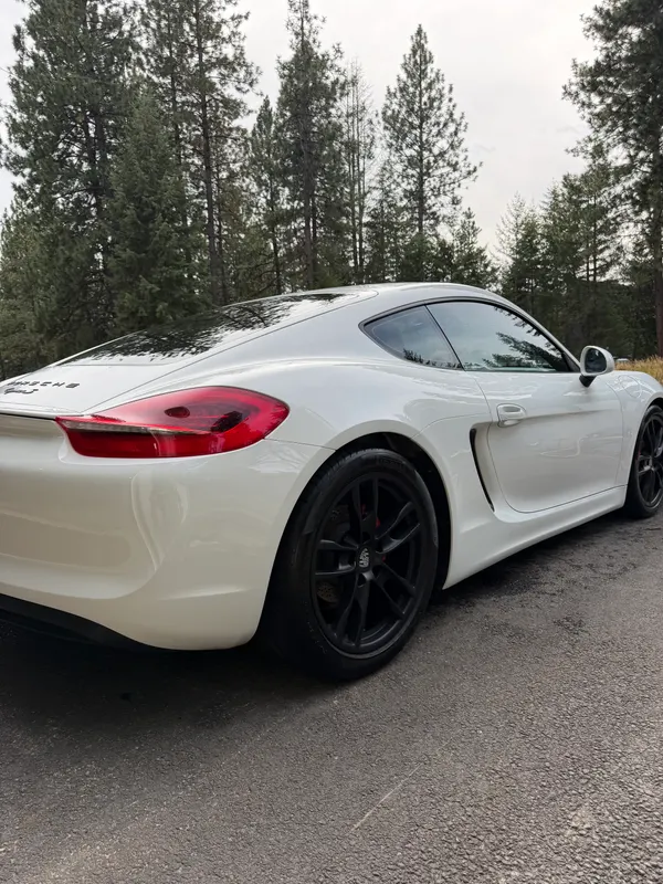 White Porsche Cayman S rear quarter after exterior detail